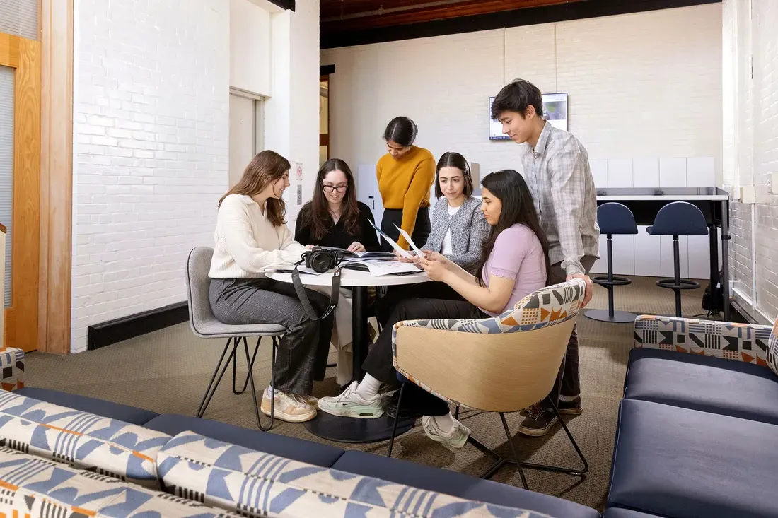 Students collaborating at a table.